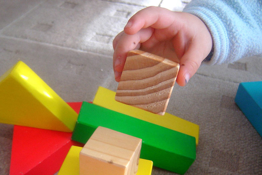 Photo of a child playing with blocks