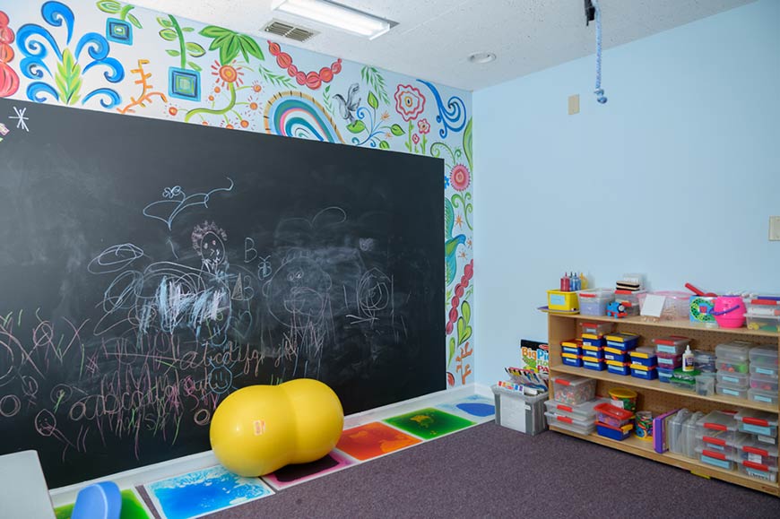 Photo of Fayetteville therapy area with chalk board