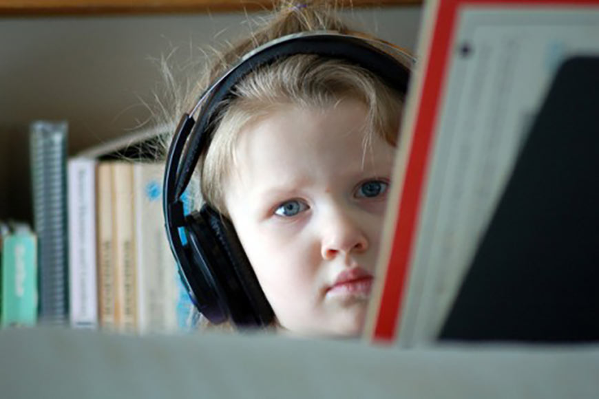 Photo of a child wearing headphones