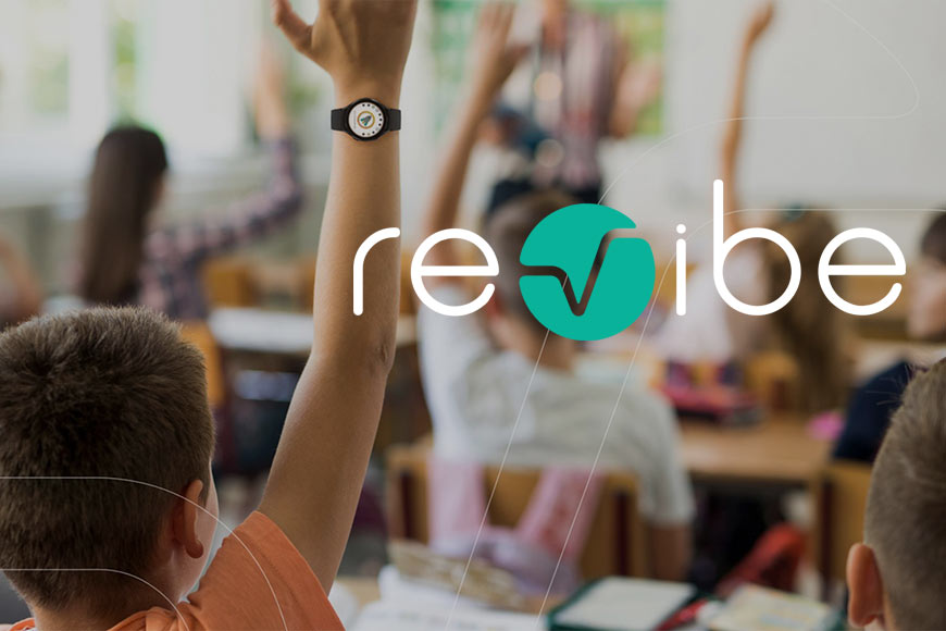 Revibe logo over photo of child wearing revibe in classroom