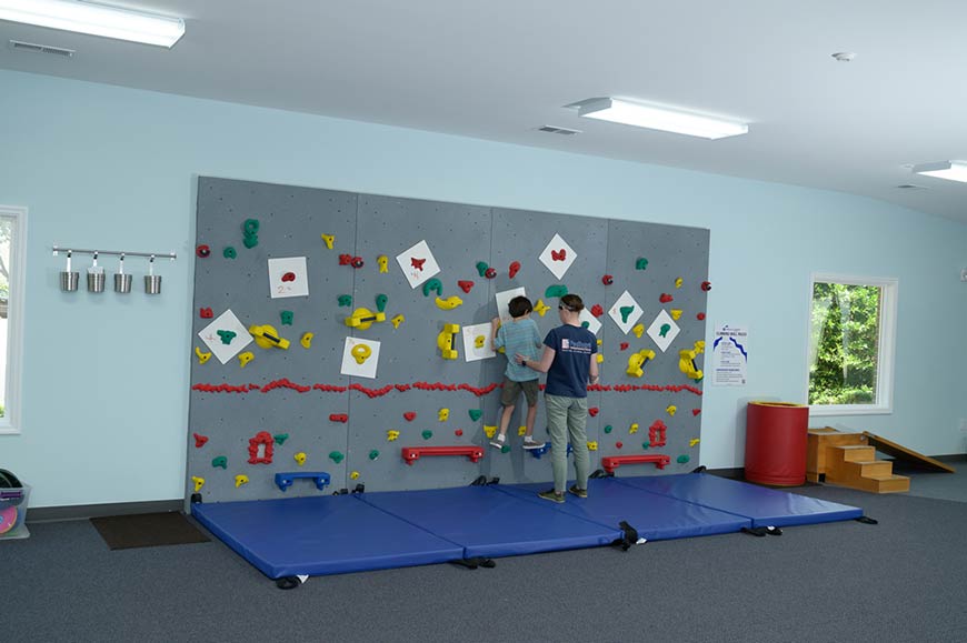 Photo of Southern Pines therapy area with rock climbing wall