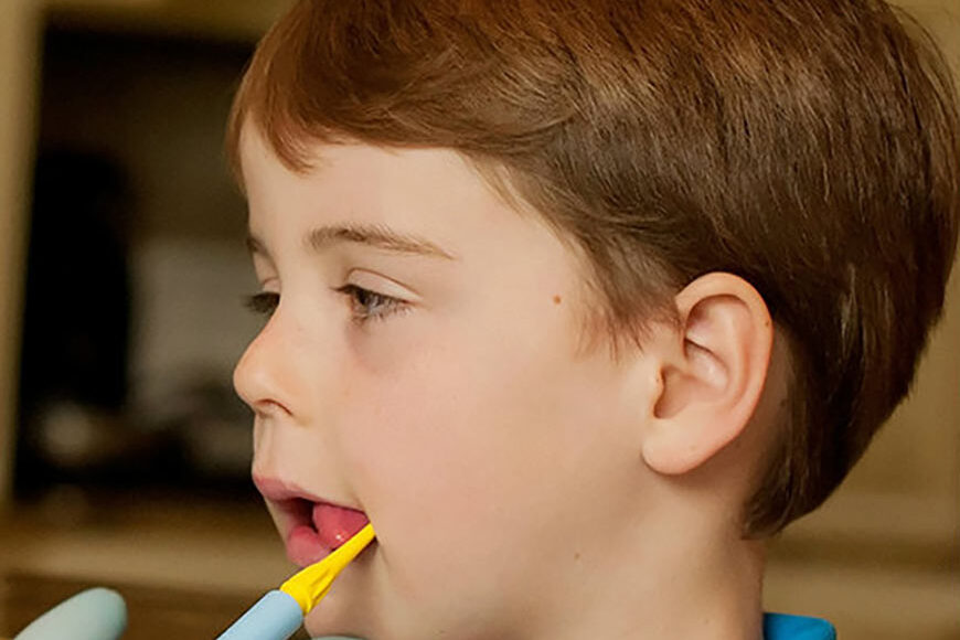Photo Of A Little Boy Getting An Oral Motor Exam