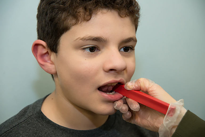 Photo of a child getting jaw assessment
