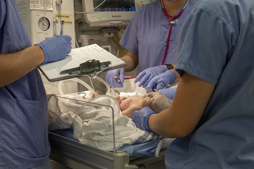 Photo of a newborn baby in the NICU