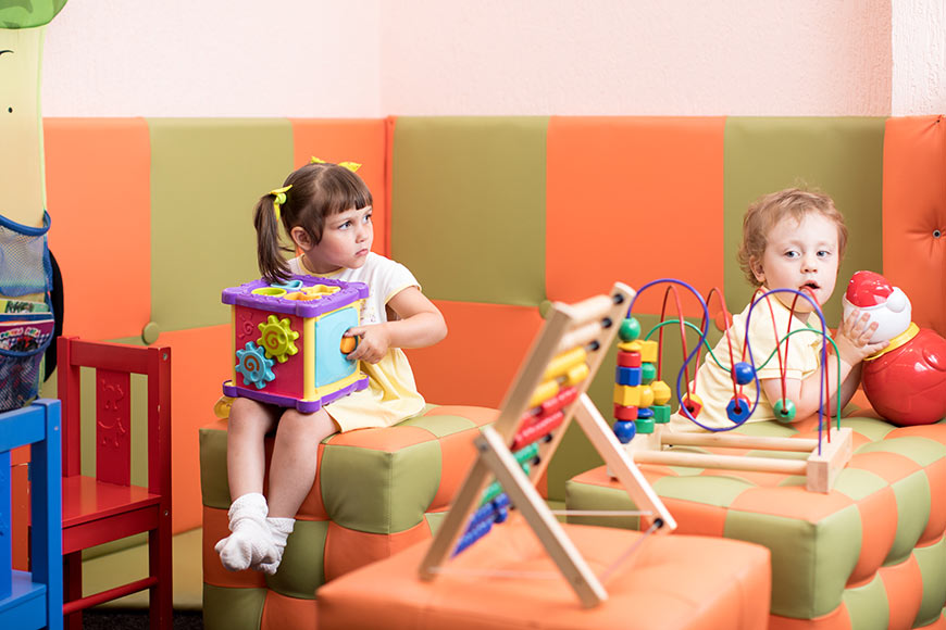 Photo of children playing with toys in a waiting room